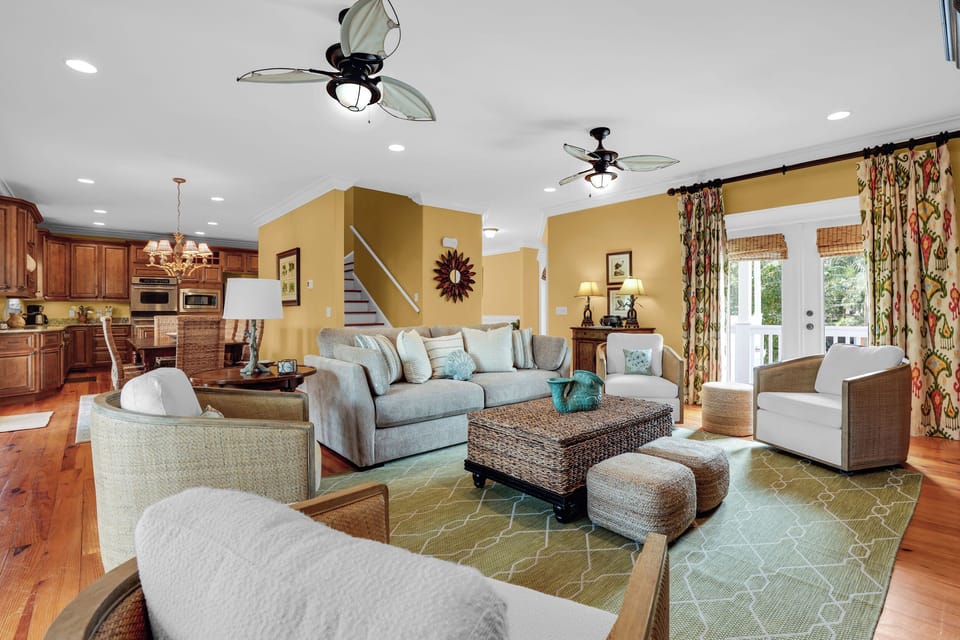 The living room is spacious and has ample seating for everyone