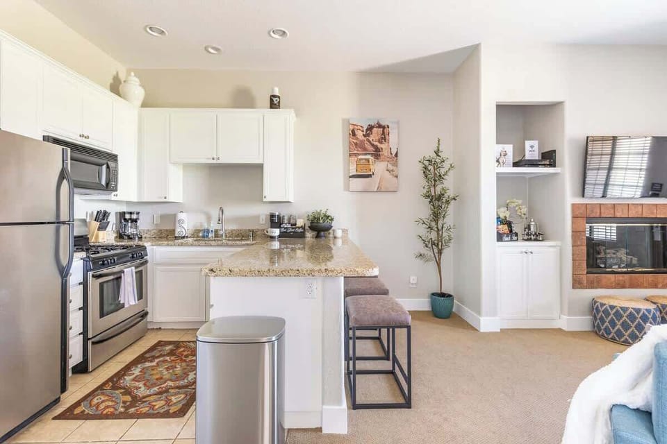 Bright kitchen with modern appliances and bar seating