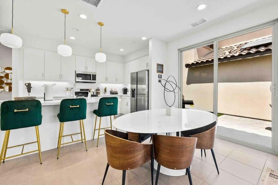 Bright kitchen with island seating and natural light