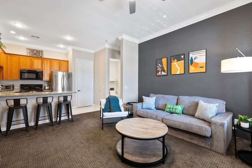 Comfortable seating area with smart TV and natural light