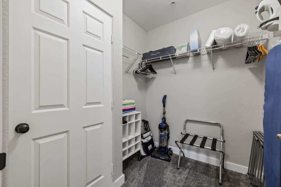 Spacious laundry area with storage shelves