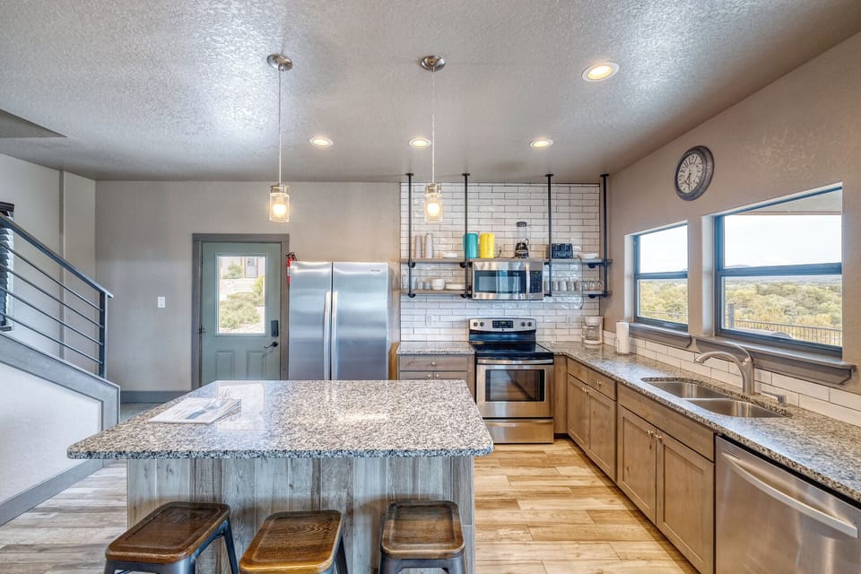 Fully stocked kitchen with seating for 4 at the bar area