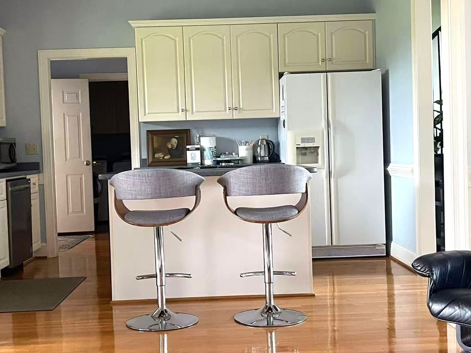 Modern kitchen island with barstools and plenty of natural light
