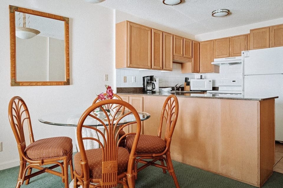 Prep simple meals in a well-equipped kitchen with breakfast bar.