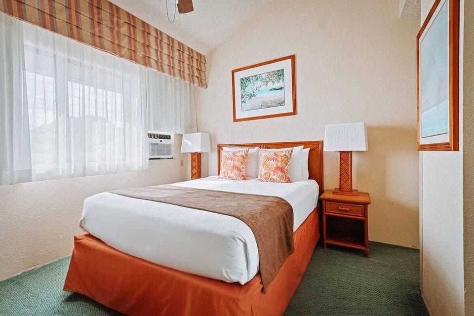 Settle into a warm, comfortable bedroom with soft bedside lighting.
