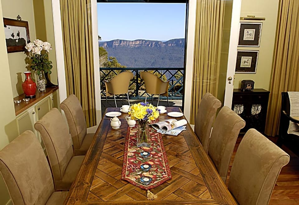 Indoor dining with French doors opening to spectacular views