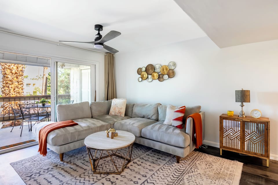 Bright living room with sectional and stylish decor.
