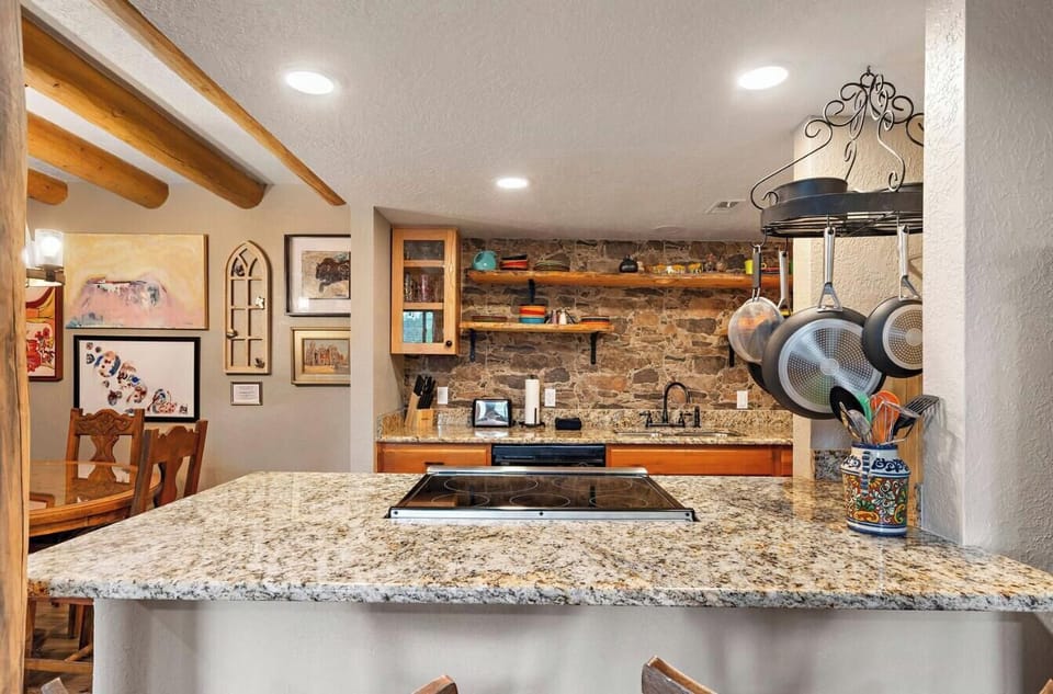 Newly renovated kitchen overlooks the living area.