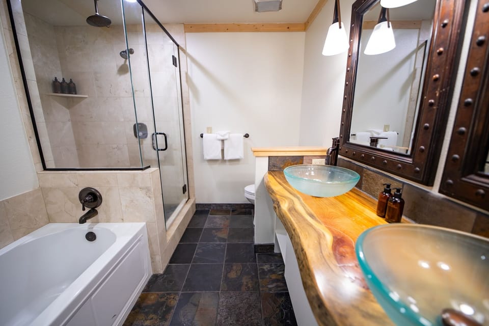 Refresh in a spa-like bath with glass shower and tub.