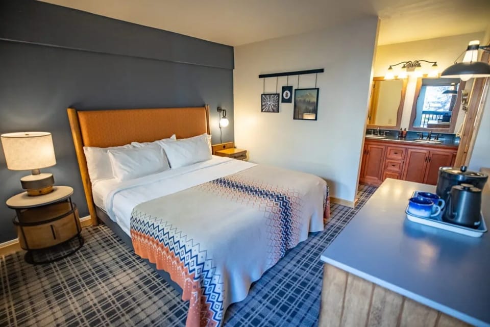Recharge in a serene bedroom with convenient in-room prep space.