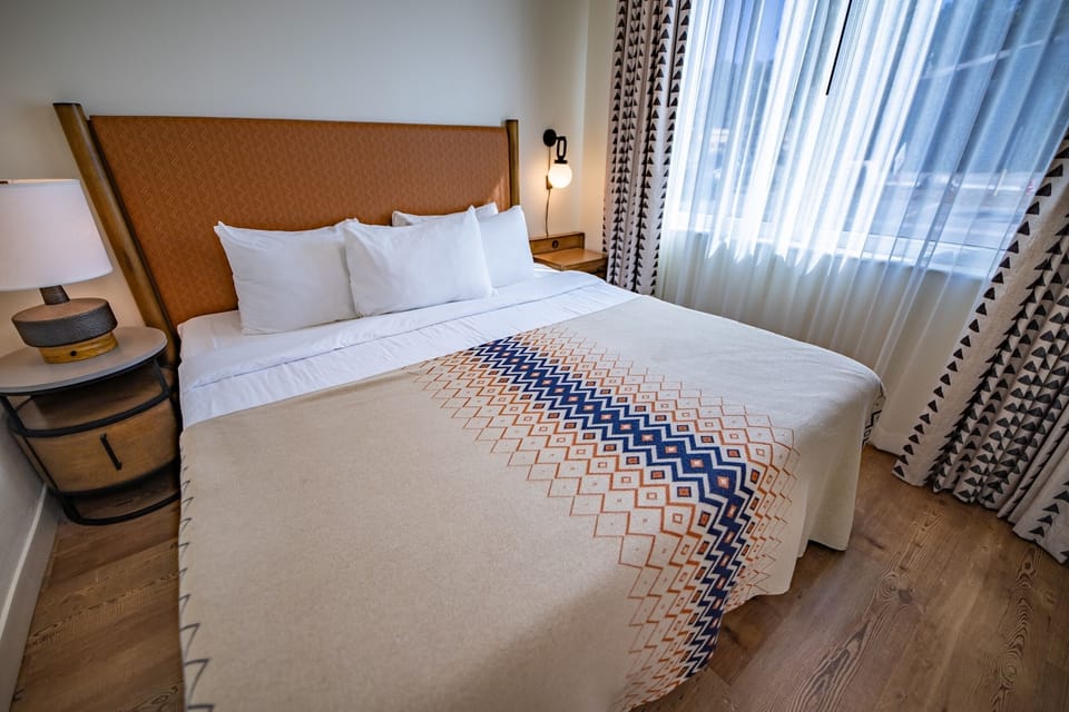 Sink into crisp linens for a restful night’s sleep.