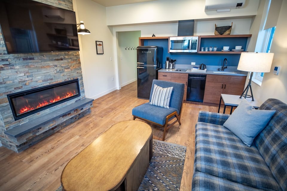 Gather by the fireplace with a handy kitchenette for snacks.