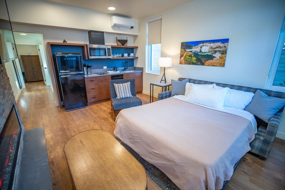 Wake up and brew coffee in your sleek studio retreat.
