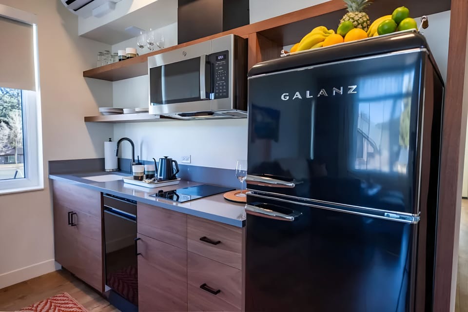 Whip up quick meals with a compact, well-equipped kitchenette.