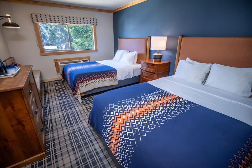 Settle into spacious comfort with two plush beds and sunlight.