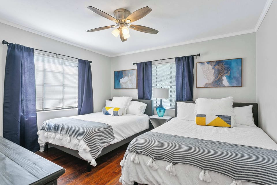 Relax in the inviting bedroom furnished with two cozy queen beds