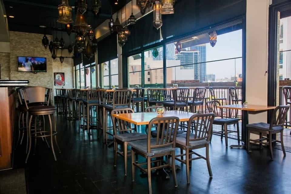 Settle in for relaxed dining beside airy, open windows.