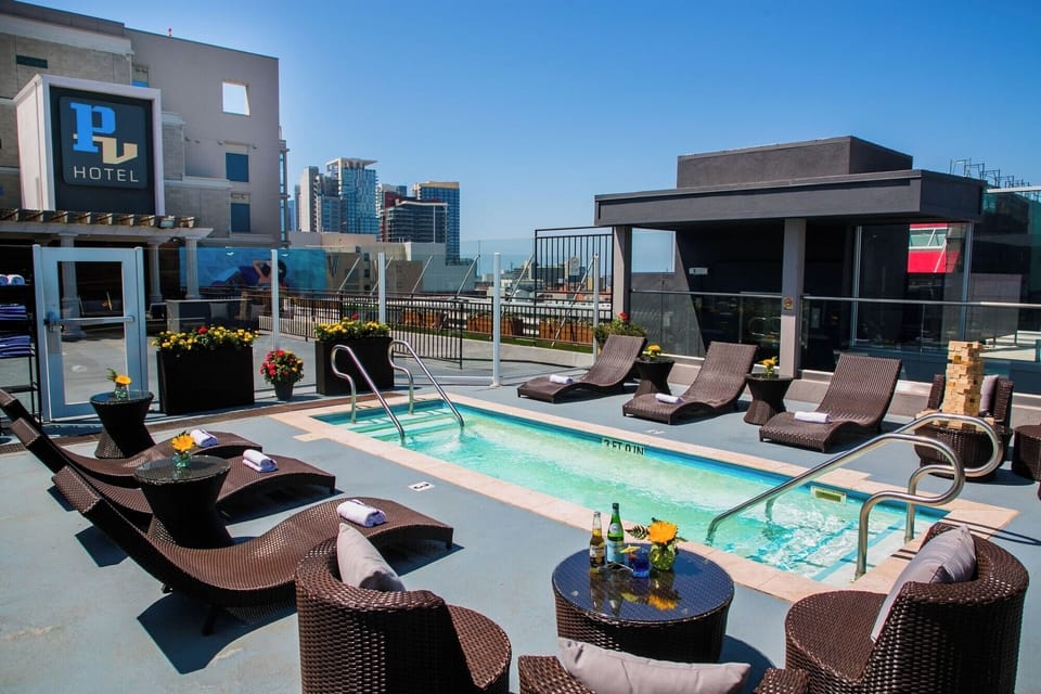 Dive into sunshine beside the rooftop pool and loungers.