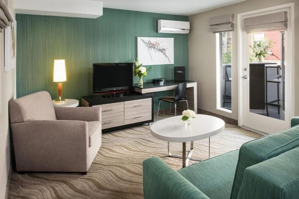 Gather in a bright living area with balcony access nearby.