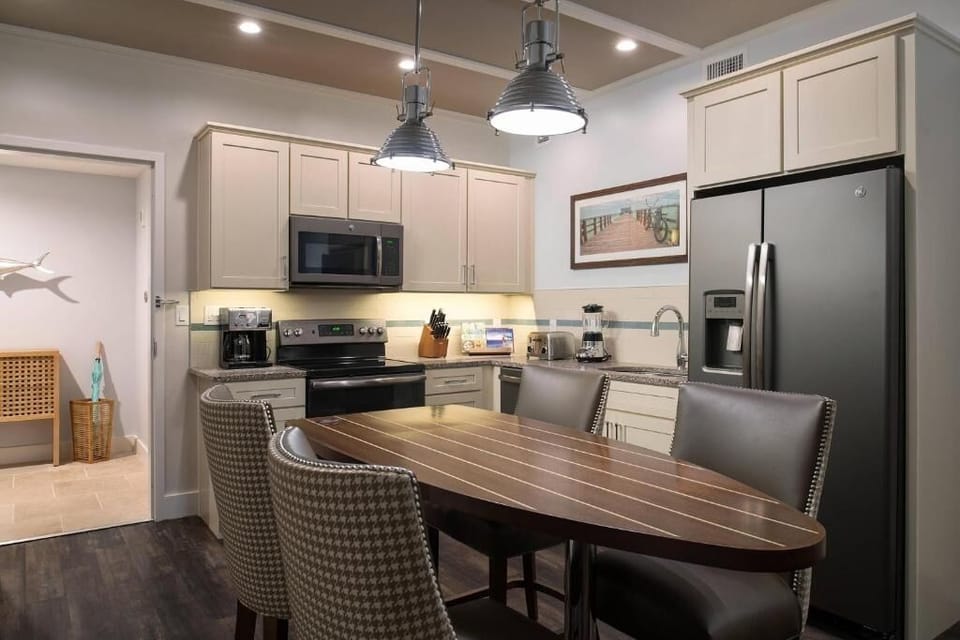 Gather and lounge in a sunlit living room by the balcony.