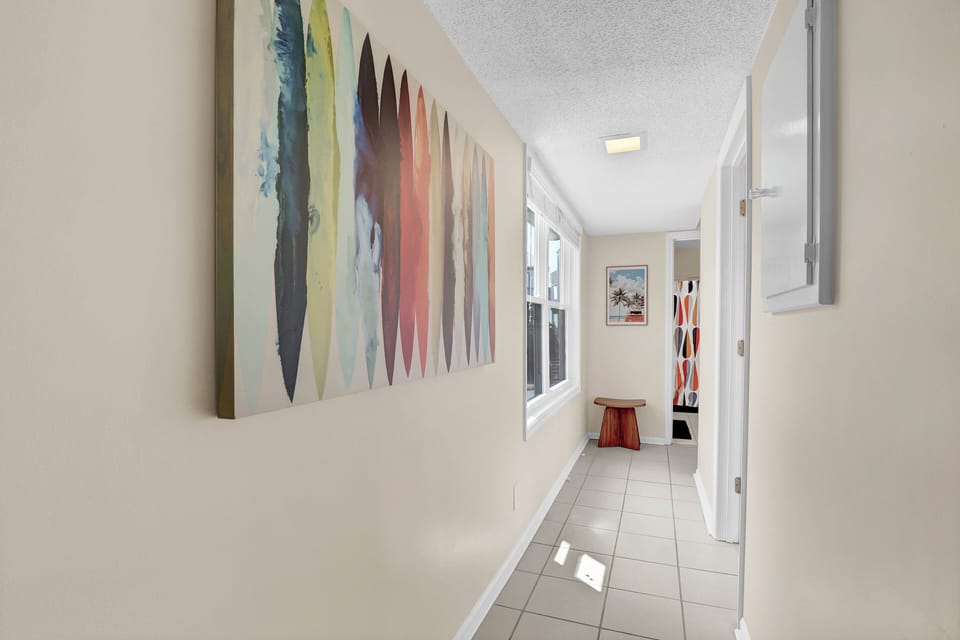 Hallway with an ocean view and access to the 2nd bedroom, bathroom, and master. 