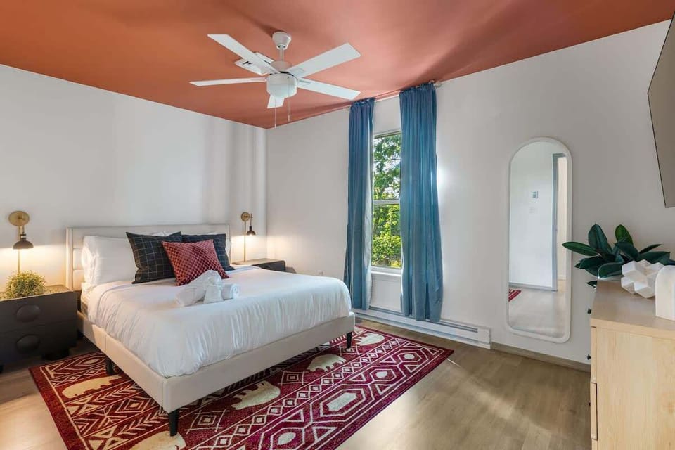 Drift into rest in the serene bedroom w/ soft lighting & a calming, airy feel