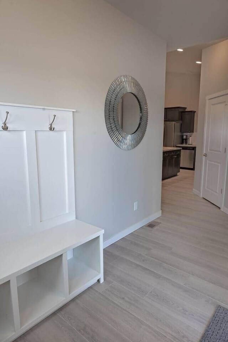 Foyer welcomes you home with a place to hang your coat and store your footwear.