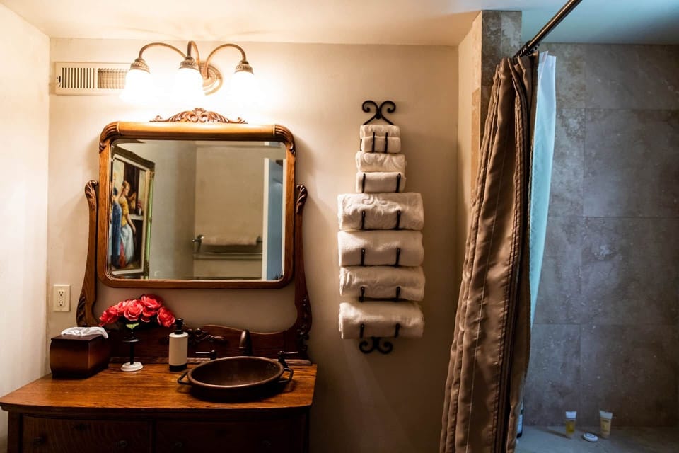 Relax in a private bath with a jetted tub and vintage-inspired vanity