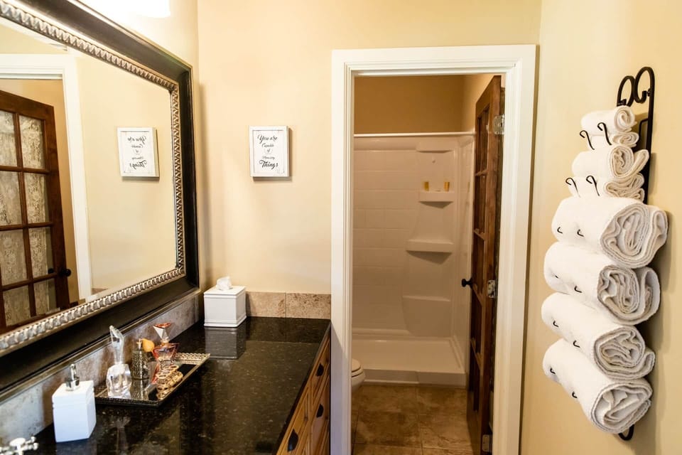 Fresh towels and a bright, spotless bath offer comfort and convenience