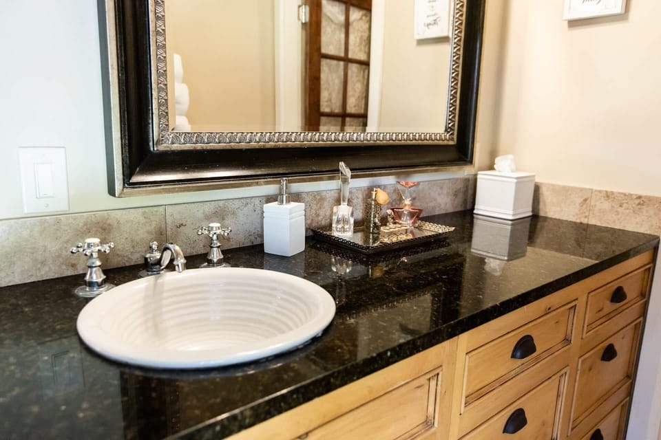 Elegant bathroom vanity with classic fixtures and thoughtful amenities