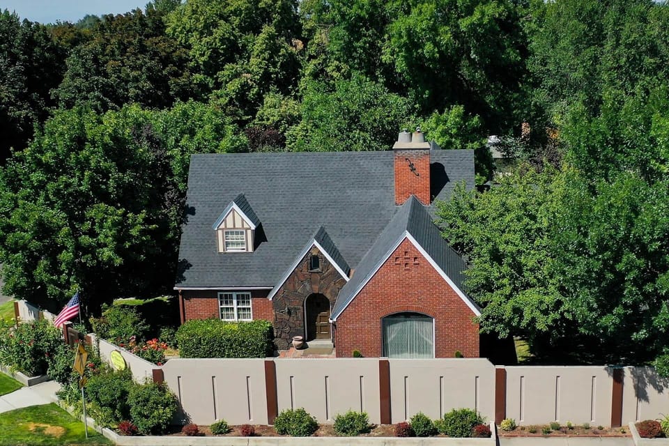 Charming Tudor brick home with gables and a peaceful garden setting