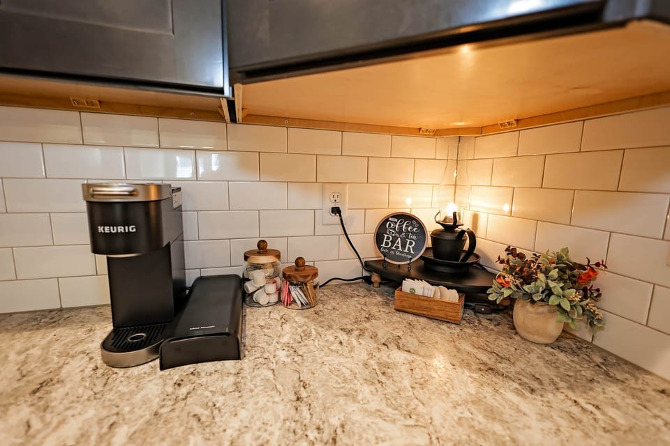 Coffee bar with Keurig, tea, and all the essentials for your morning routine.