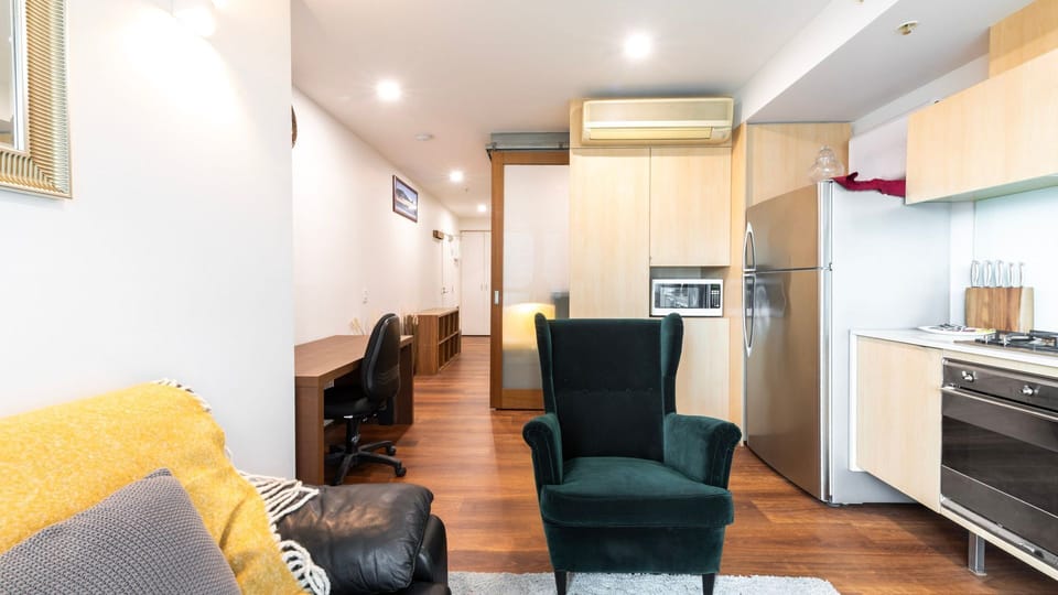 Open-plan living with kitchenette and workspace