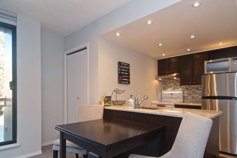 Open concept kitchen flows to dining area