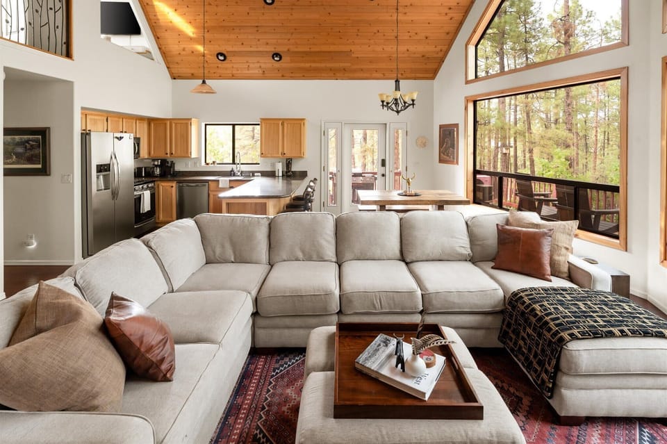 Get ready to fall in love with our vaulted ceilings, warm wood accents, and incredible floor-to-ceiling views that bring nature right to your doorstep.