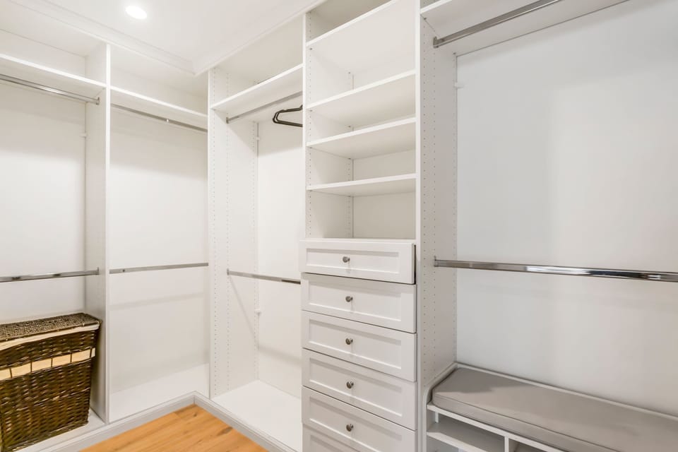 Warning: May induce over-packing! Our dream walk-in closet is so spacious, you'll actually want to bring all your favorite outfits (and maybe a few new ones!).