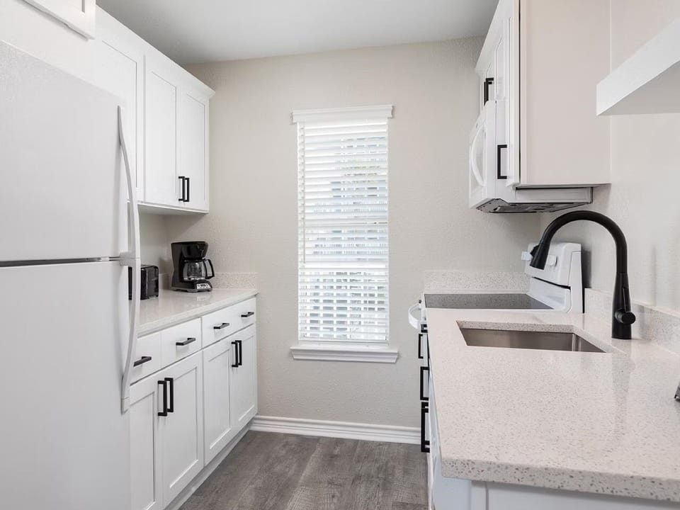 Cook with ease in the bright kitchen with ample counters.
