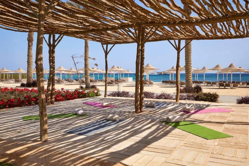 Stretch at sunrise with ocean breezes on the shaded deck.