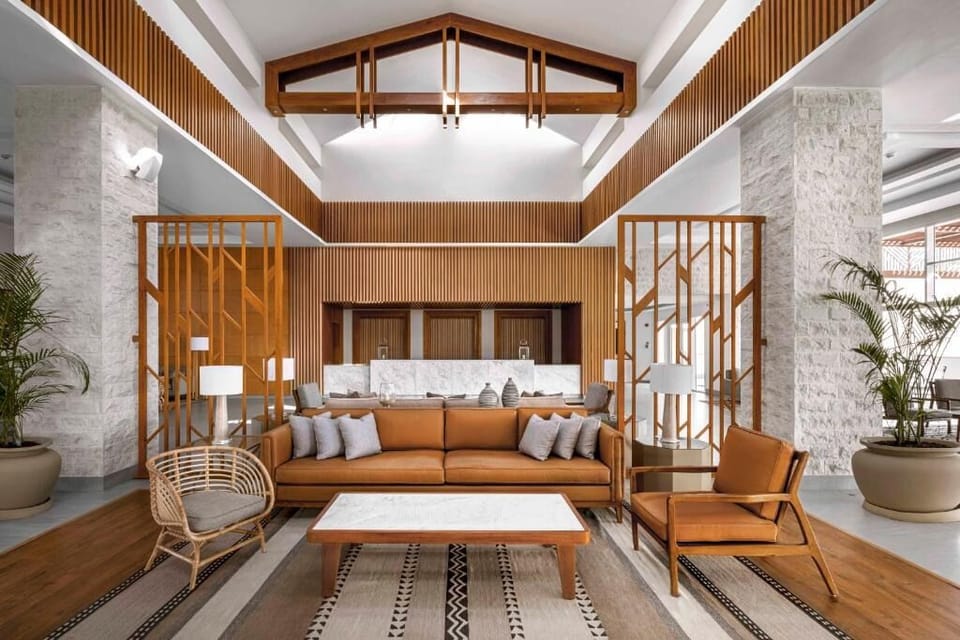 Gather for evening chats beneath dramatic, softly lit ceilings.