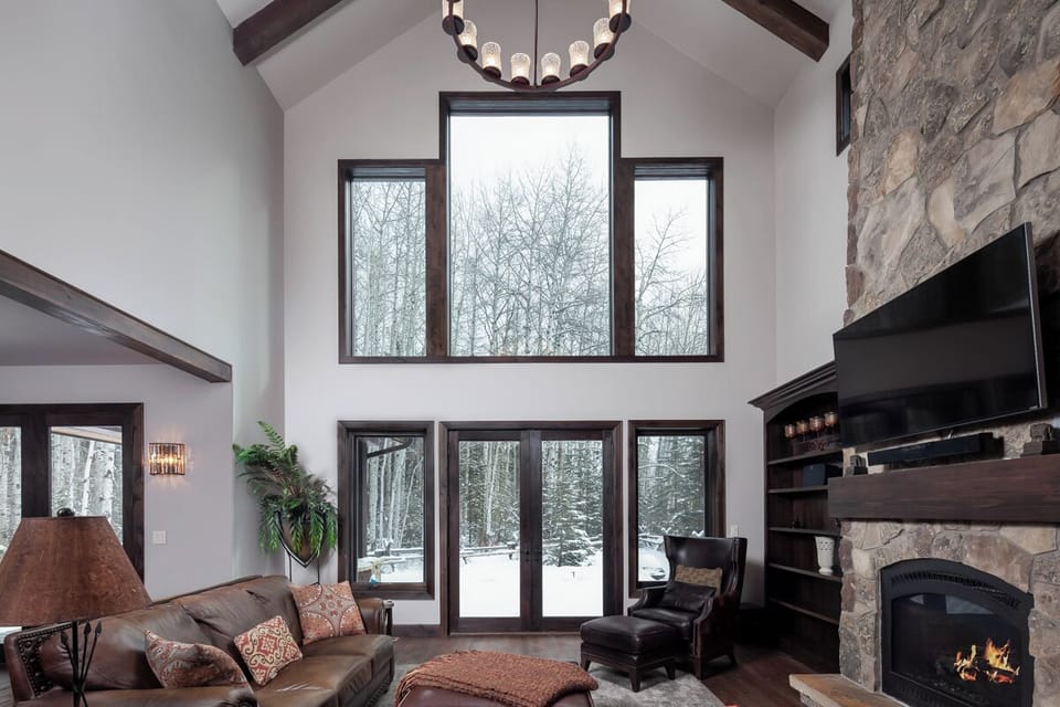 Soak up soaring windows and fireside comfort all evening.
