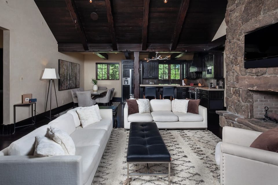 Lounge together in an open great room with rustic warmth.