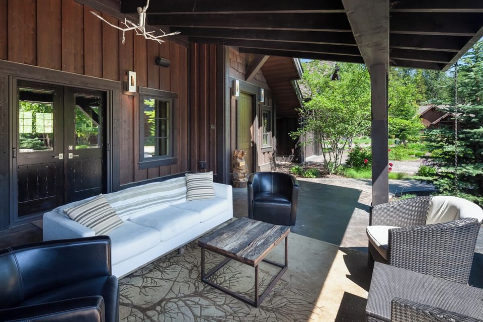 Sip morning coffee on the covered porch with forest views.