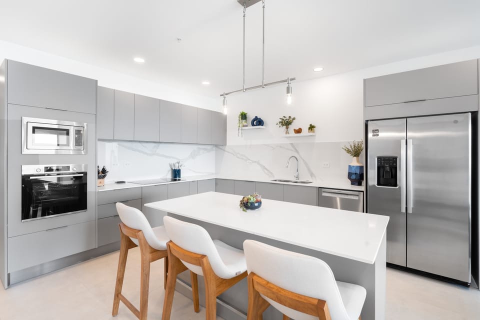 Share laughter and delightful flavors from this luminous kitchen.
