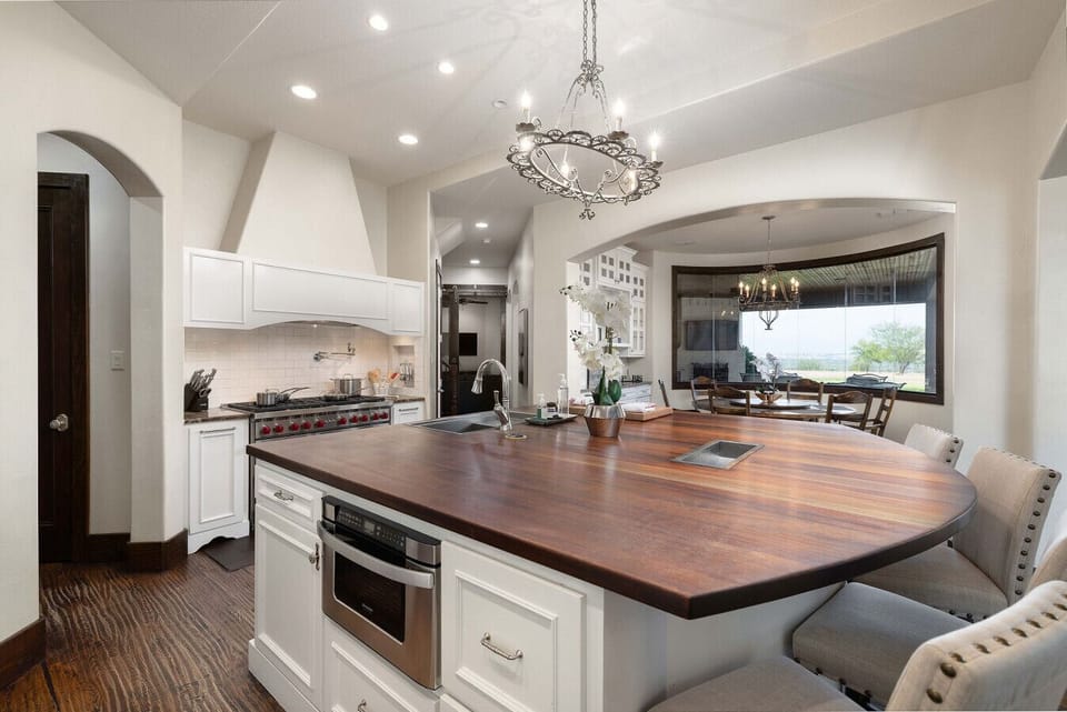 Wolf range, prep sink, and oversized island are standard at Fossil Valley Ranch.
