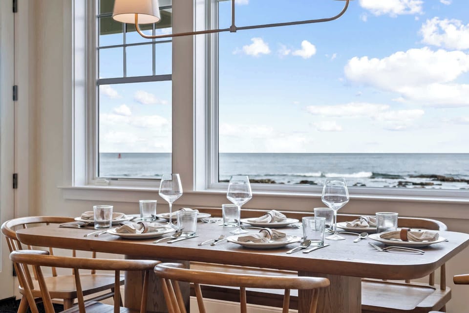 Sunny breakfast nook with windows facing the water