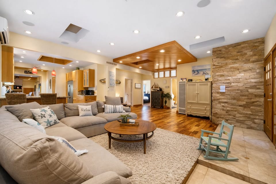 Spacious open-concept living area with comfortable seating and natural flow.