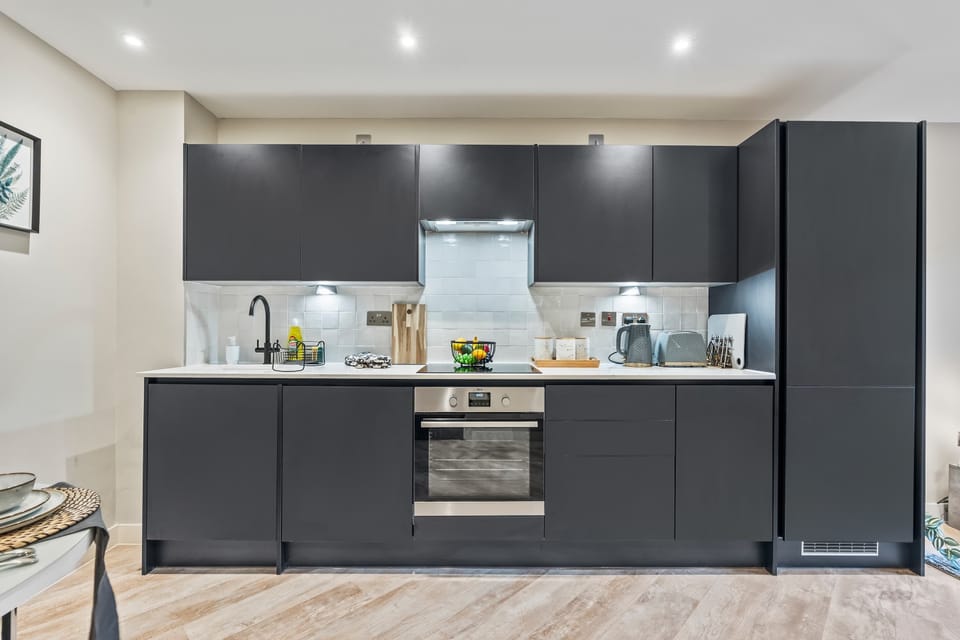 The sleek modern kitchen is fully equipped for you to prepare and cook meals during your stay. There is a kettle, toaster, full size dishwasher and oven with electric hob so you will feel right at home.