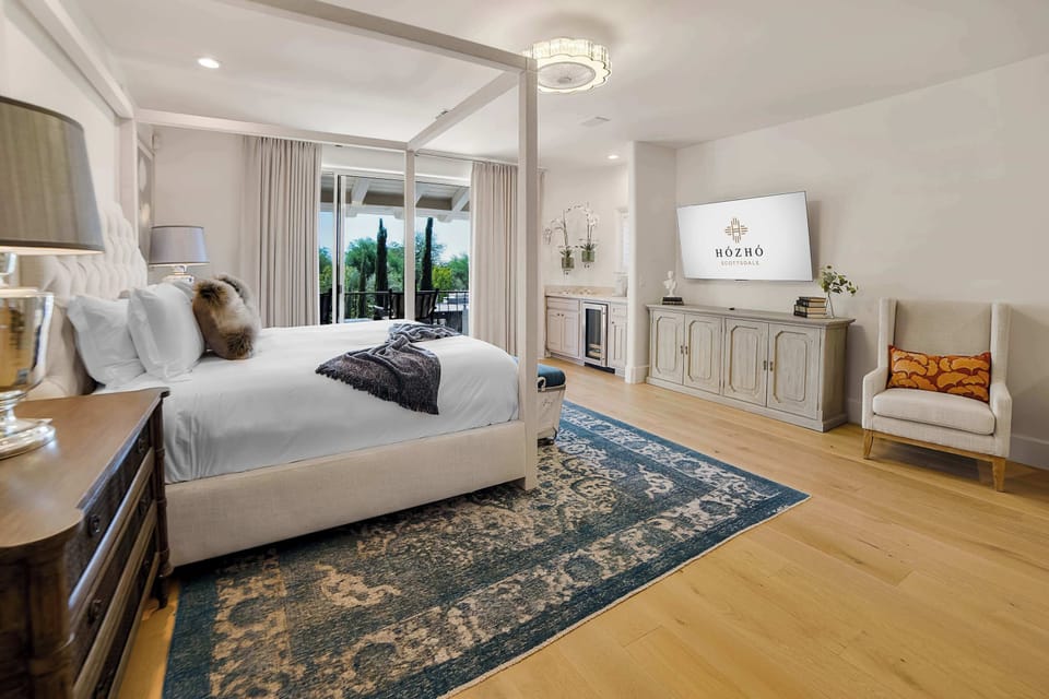 Drift off in bright comfort, waking to serene desert views.