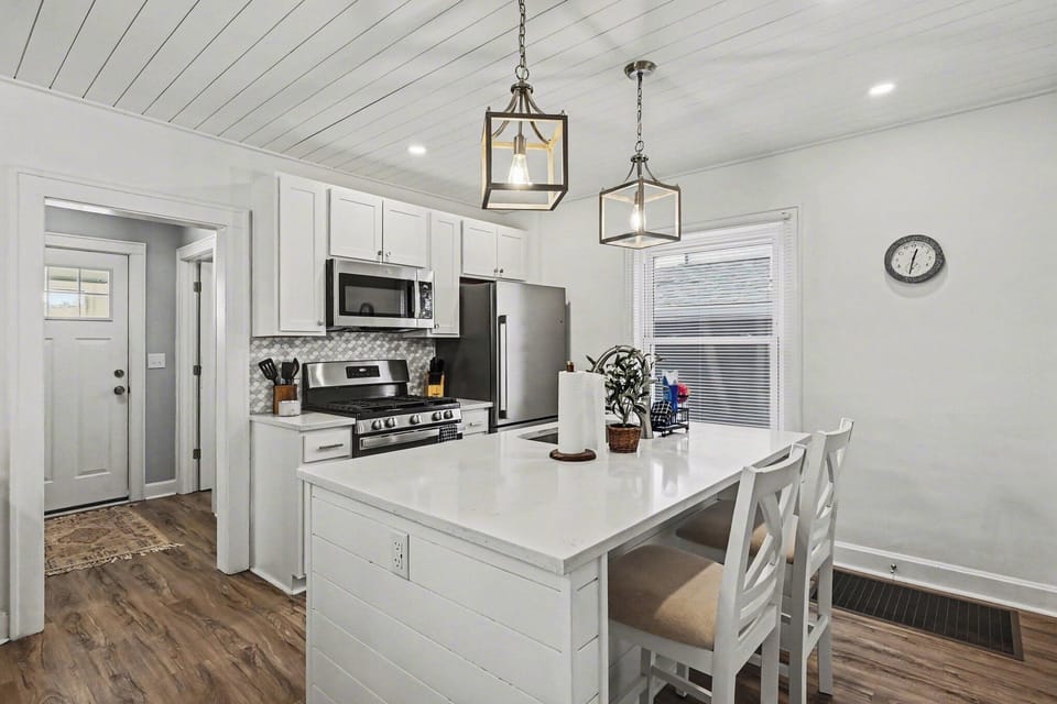 Updated kitchen with island seating and modern appliances