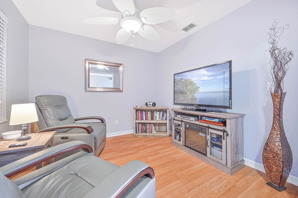 Cross12 - The den is setup as a TV room with very comfortable recliners and a large smart TV with cable